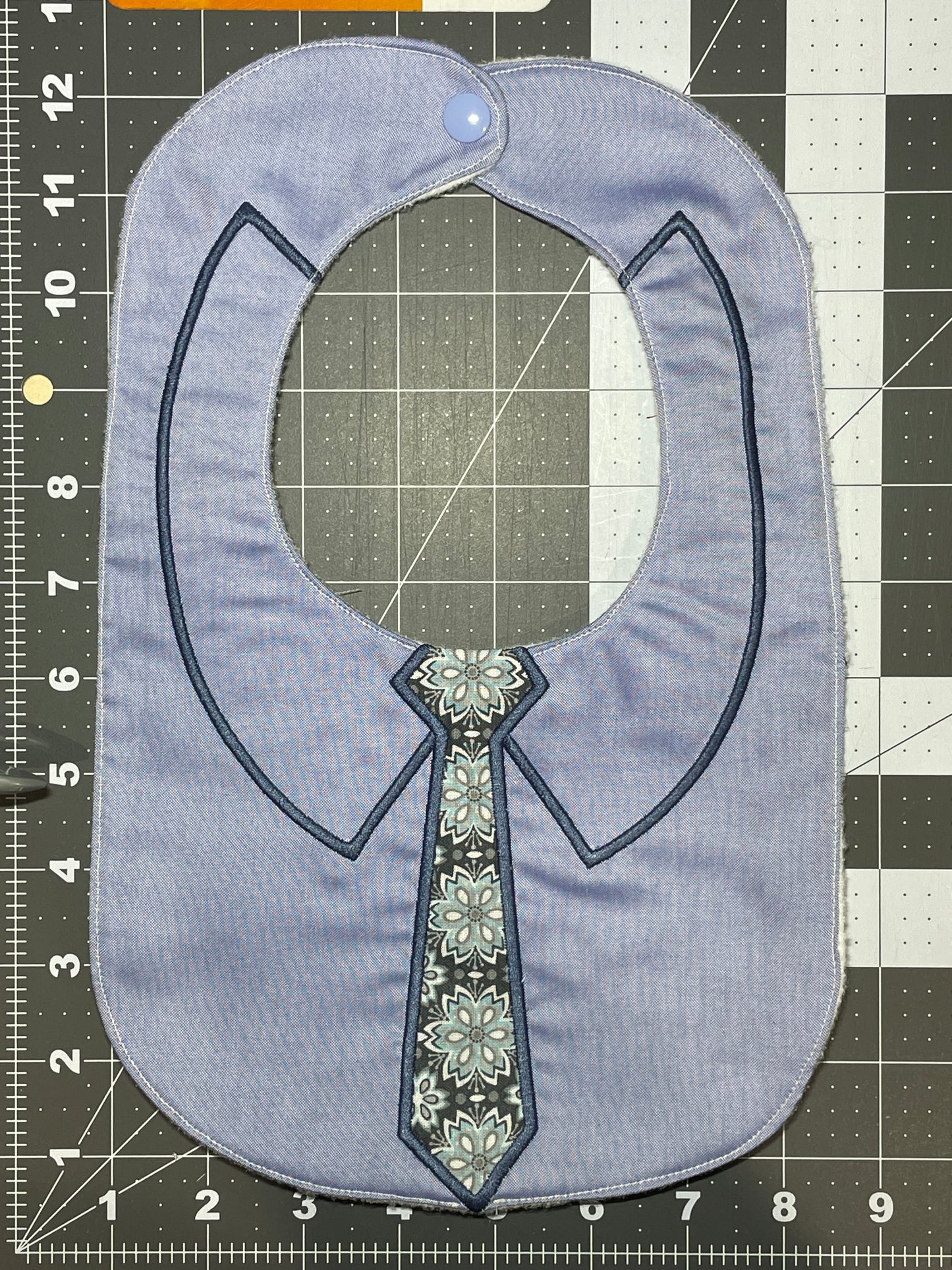 Tie Bib - Blue floral tie